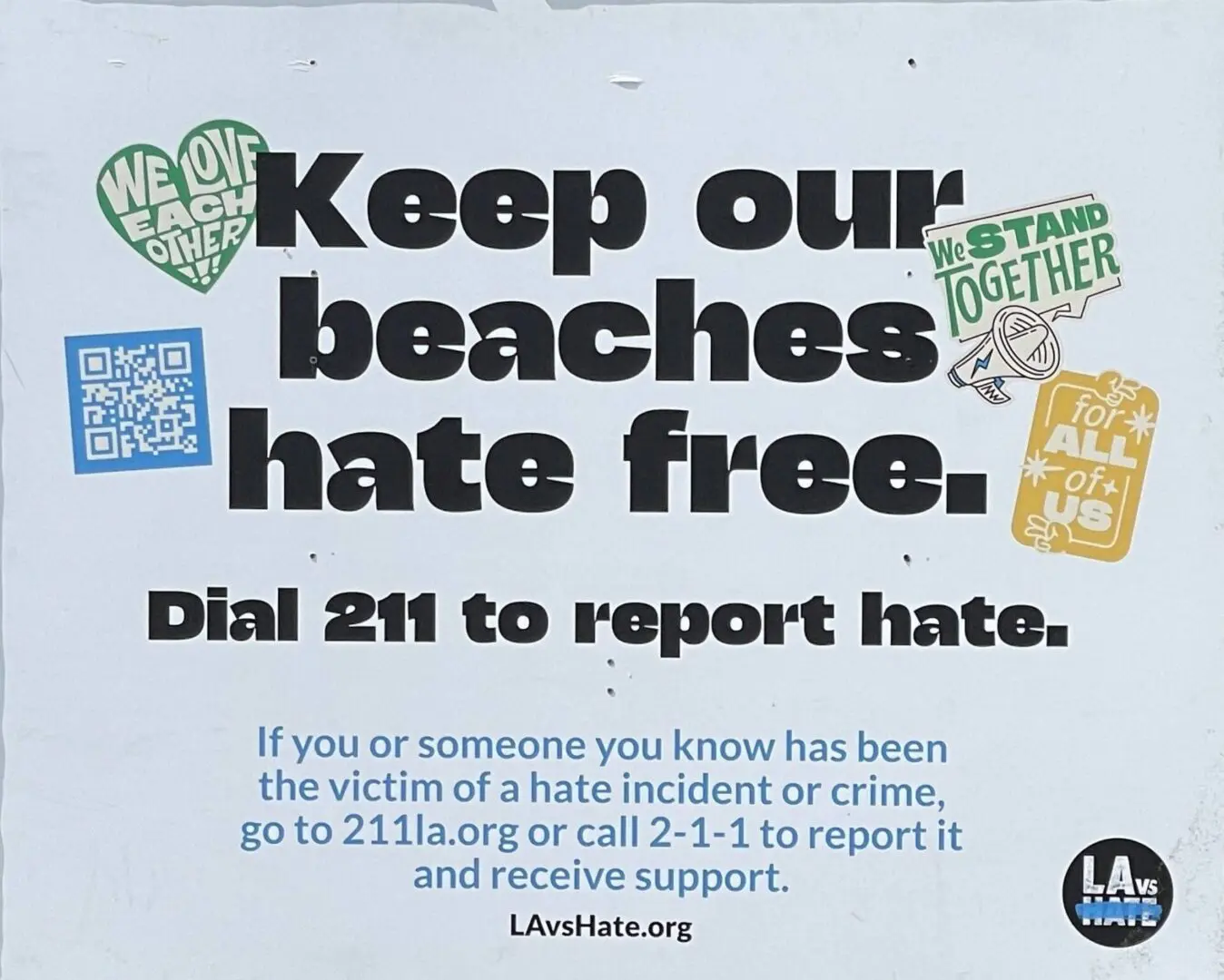 A poster with the words " keep our beaches hate free ".